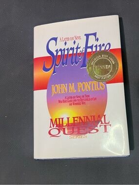 Spirit of Fire by John M. Pontius - White with Purple & Orange Cover